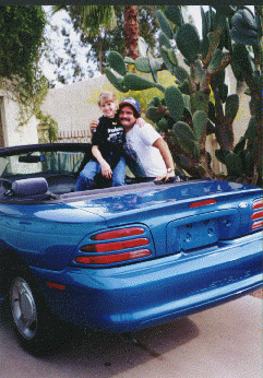 tom
                        1998 with blue car and lacey